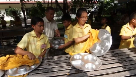 Students of Pieamsuwan school in Buddhist Camp, Students are washing dishes Stock Footage 76995416