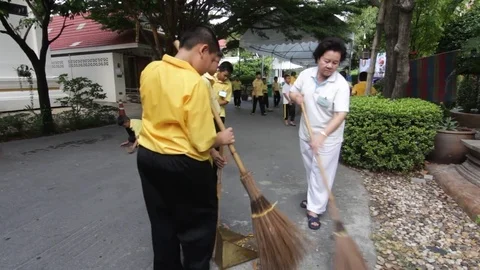 Students of Pieamsuwan school in Buddhist Camp, Students are sweeping the floor Stock Footage 76995590