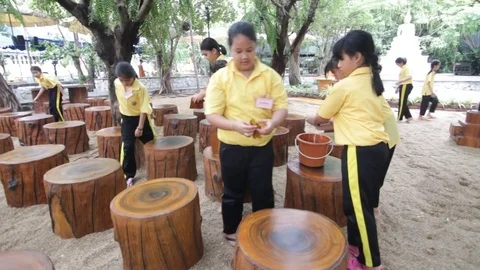 Students of Pieamsuwan school in Buddhist Camp, Students are sweeping the floor Stock-Footage 76996007