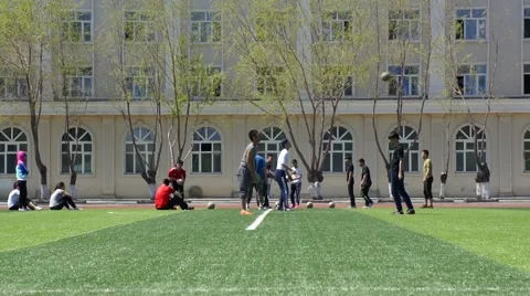 Students playing balls on the stadium Stock Footage 50214437