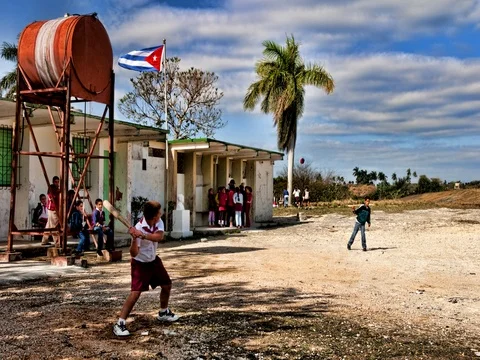 Students playing basseball outside school in Habana Province in countryside 스톡 동영상 75687566