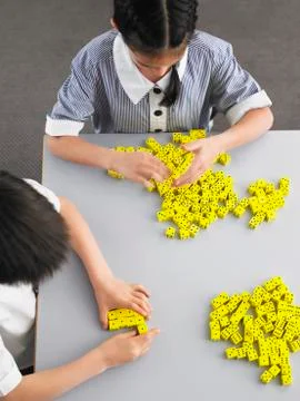 Students Playing With Dice In Class Stock Photos