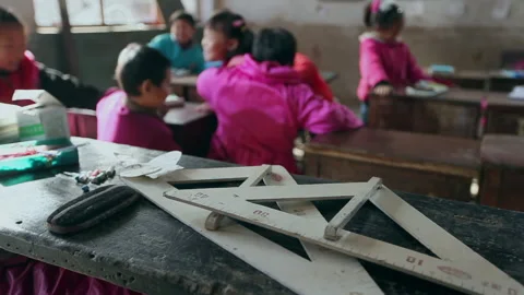 Students from a poor elementary school walk into the classroom, Hebei, China Stock Footage 143898210