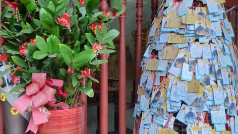 Student's prayers hanging at temple for good score in exam Stock Footage 267526557