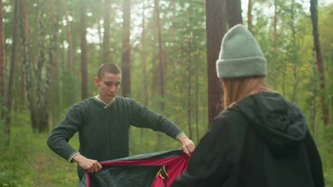 Students Prepare Camping Tent Together in Forest Stock Footage 310476305