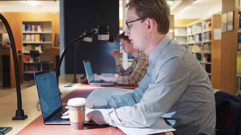 Students prepare for classes in the library Stock Footage 78598088