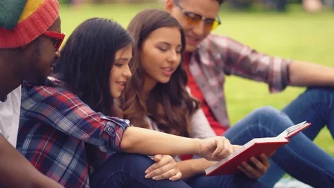 Students prepare for a lecture and read a given book together. Stock Footage 126284291