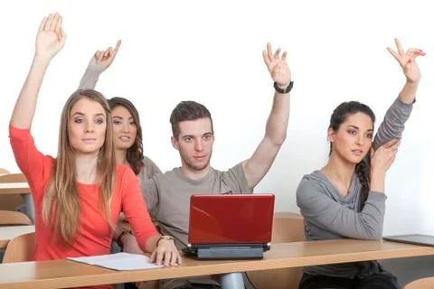Students put up their hands Stock Photos