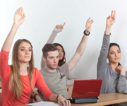 Students put up their hands Stock Photos