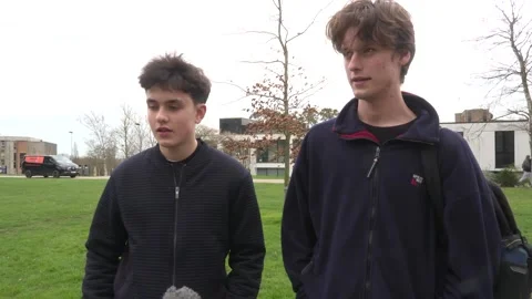 Students queue for antibiotics at the University of Kent in Canterbury amid men Video stock 330876425