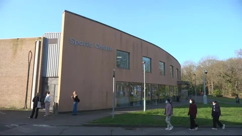 Students queue for meningitis B vaccine at University of Kent after deadly outb Stock Footage 331064947