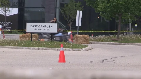 Students race electric cars on college campus in battery powered endurance event Stock Footage