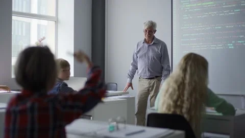 Students raising hands answering question of teacher during lesson Video stock 142491486