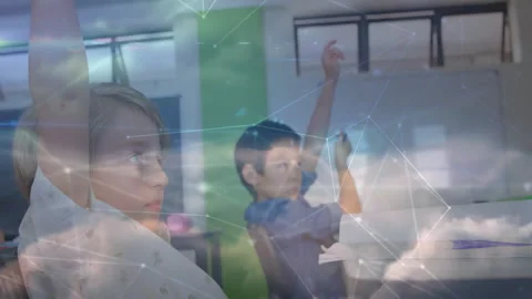 Students raising hands in classroom answering question as network graphic fading Stock Footage 312280346