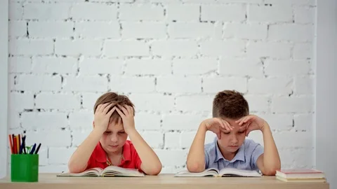Students read a book in class Stock Footage 92069518