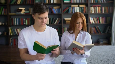 Students reading a book in library, 4 k students reading book at school Stock Footage 86182491