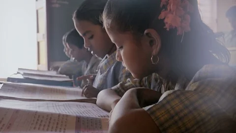 Students reading a book in their classes. Stock Footage 104988569
