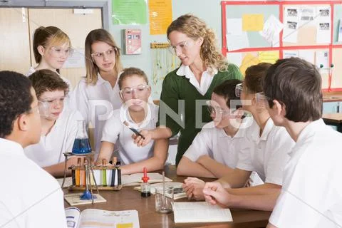 Photograph: Students receiving chemistry lesson in classroom #21570607