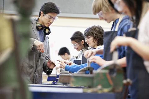 Students receiving instruction in machine shop class Stock Photos