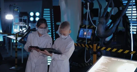 Students record the data of the scientific laboratory, the results of the Stock Footage 102985571