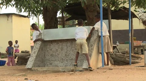 STUDENTS REMOVING SECURITY COVER FROM WATER TAPS Stock Footage 60626161