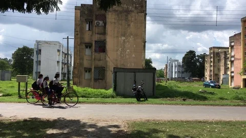 Students returning by cycling through a township Video stock 118351800