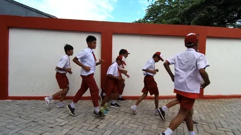 Students run to the school field and children fall in the floor Stock Footage 108399029