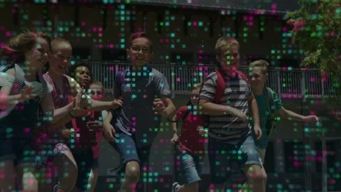 Students running toward camera across school lawn during recess, pixel grid Stock Footage 332772347
