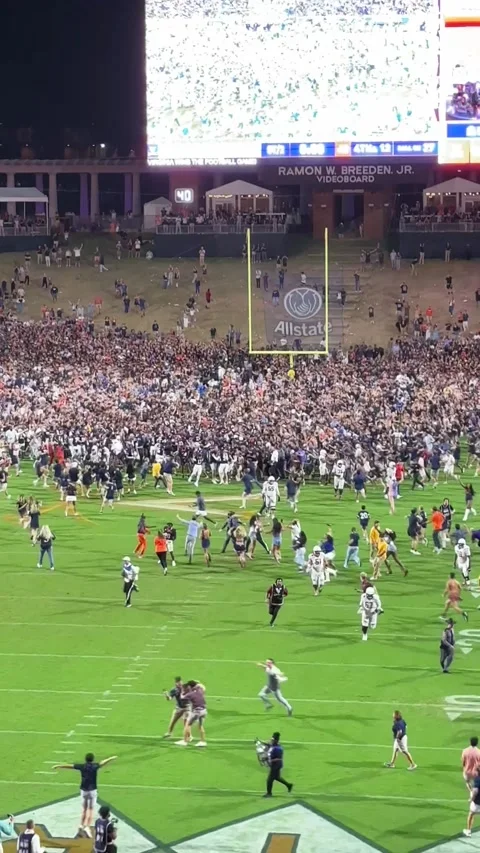 Students Rush the Field on a Double-Overtime Win Over Florida State, Charlottesv Stock Footage 318110647