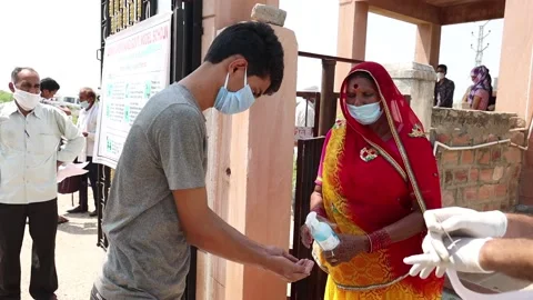Students sanitize hands before entering in  school or college to take exams Stock Footage 139379783