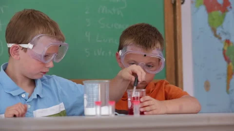 Students at school doing a science experiment Stock-Footage 62344203