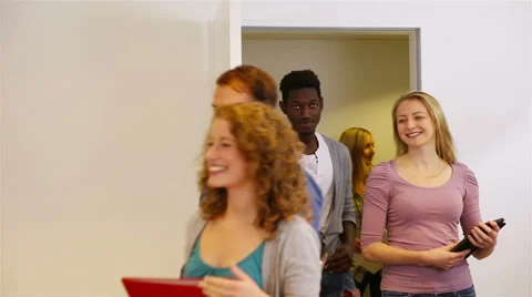 Students in school walking through door Video stock 33468421