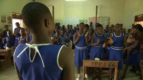STUDENTS SINGING AND CLAPPING IN A CLASSROOM 2 Stock Footage 60116231