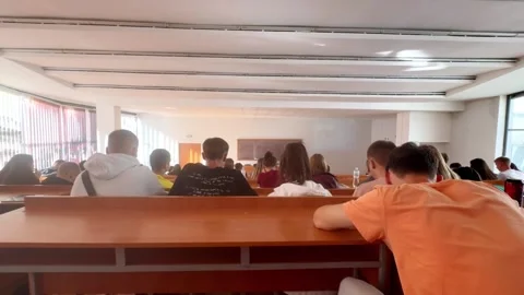 Students sit in the classroom during a lecture at the university Stock Footage 284990218