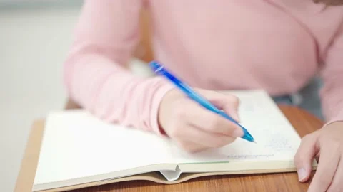 Students sit for exams at the desks in the classroom at the university. Stock Footage 147956985