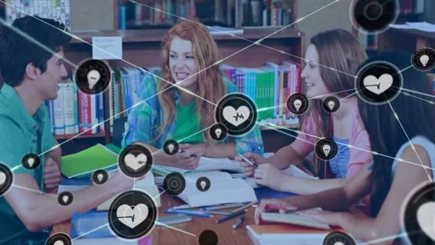 Students sitting around school table, heart icon appearing over group showing Stock Footage 329904548