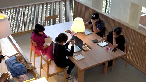 Students Sitting In The Library Stock Footage 202066369