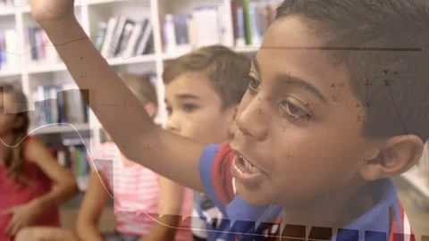 Students sitting in library by shelves watching boy wearing striped polo raising Stock Footage 332469445