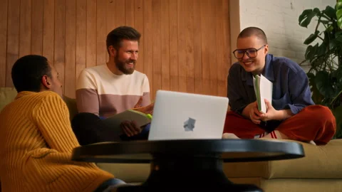 Students on sofa use laptop, tablet and notebooks Stock Footage 268203050