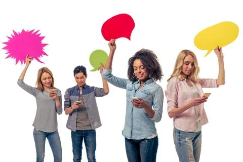 Students with speech bubbles and gadgets Stock Photos