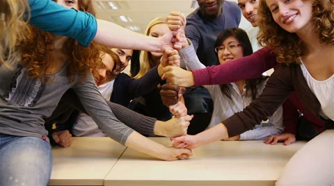 Students stacking fists in school Stock Footage 32818911