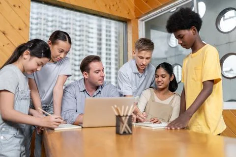Students stand and separate to two group for taking note together. Edification. 스톡 사진