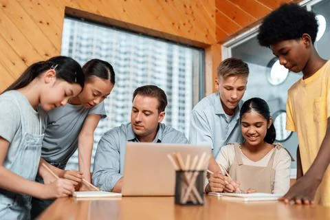 Students stand and separate to two group for taking note together. Edification. 스톡 사진