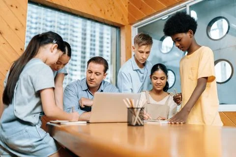 Students stand and separate to two group for taking note together. Edification. 스톡 사진