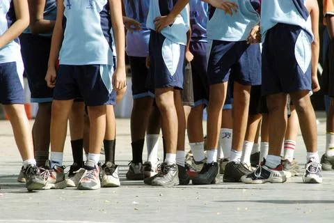 Students standing in queue during basket ball practice session in school i... Stock Photos