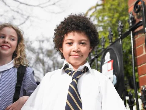 Students Standing By School Gate Stock Photos