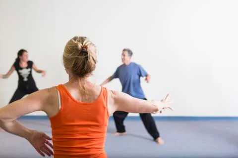 Students stretching in acting class Stockfoto's