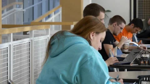 Students study in the cafeteria of the University Center building. Stock Footage 100000142
