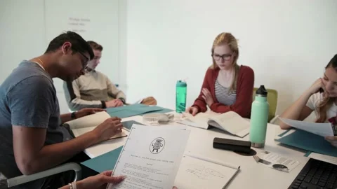 Students studying in class with document... | Stock Video | Pond5