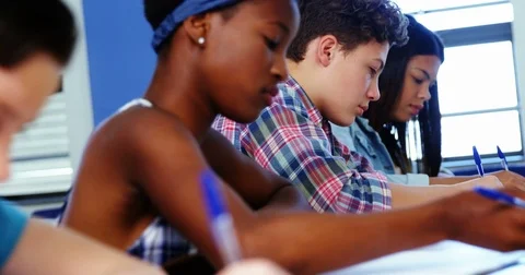 Students studying in classroom Stock Footage 74580833